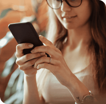 beautiful-young-woman-using-smartphone-home