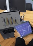 business-person-looking-finance-graphs (1) (1)-1