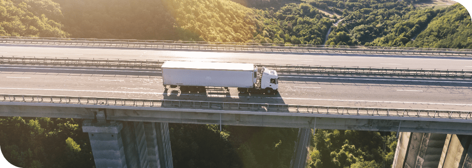 trucks-highway-mountain-sunset (1)