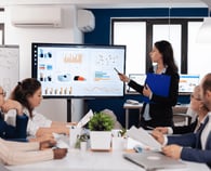 young-team-leader-big-corporation-briefing-coworkers-pointing-graph-meeting-corporate-staff